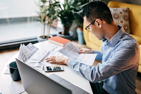 Man using calculator