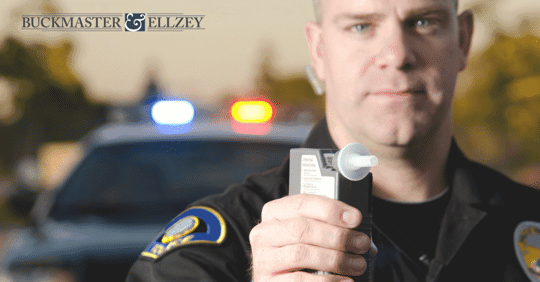 Police officer about to perform a breathalyzer test